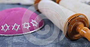 Jewish holidays, during prayer items kippa with prayer shawl tallit on shofar, torah scroll