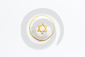 Jewish Kippah Yarmulkes hats with Star of David on white background. Religion Judaisim symbol. Top view, copy space