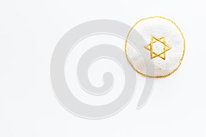 Jewish Kippah Yarmulkes hats with Star of David on white background. Religion Judaisim symbol. Top view, copy space