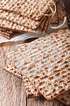 Jewish kosher matzah macro on a table. Vertical