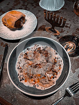 Jewish kreplach dumplings with mushrooms on a gray table photo