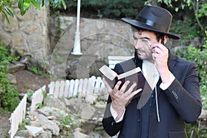 Jewish man examining a book