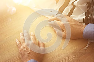 Jewish man hands next to tallit. Jewish traditional symbol. Rosh hashanah jewish New Year holiday, Shabbat and Yom kippur concep photo