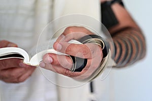 Jewish man praying with Tallit and Tefillin