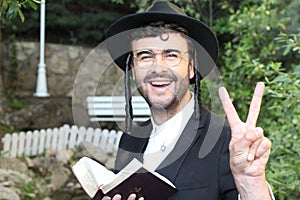 Jewish man showing the peace sign