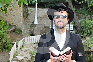 Jewish man wearing pixilated sunglasses