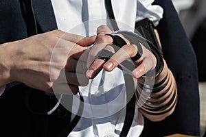 Jewish man wrapping tefillin before morning prayers in Israel