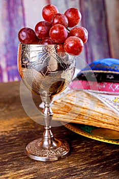 Jewish matzah unleavened bread, wine cup with a Passover holiday attributes