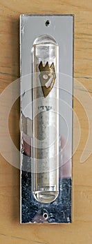 A Jewish Mezuzah which is mounted on the side post of a door way. photo