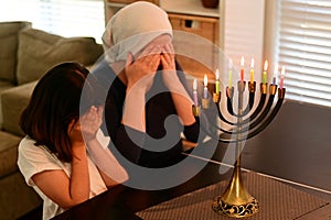 Jewish mother and daughter blessing on Hanukkah Jewish holiday