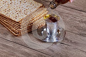 Jewish Pesah celebrating, matzoh and traditional cup kosher wine
