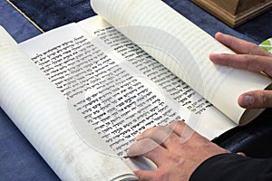 Jewish Rabbi reads The Megillah Scroll Book of Esther photo