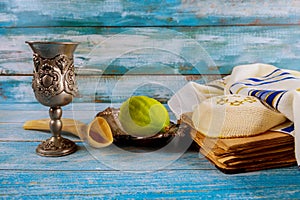 Jewish festival of Sukkot the traditional symbols Etrog, lulav, hadas, arava. praying book kippah Tallit photo