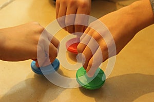 Jewish traditional chanuka toy. Children playing with colorful driedles.