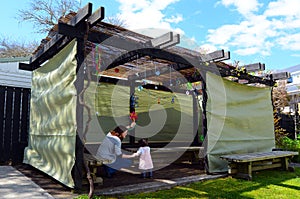 Jewish woman and child visiting their family Sukkah photo