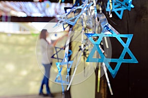 Jewish woman decorating here family Sukkah photo