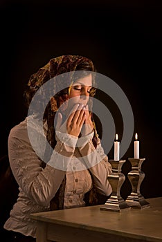 Jewish Woman Prays Over Sabbath Candles