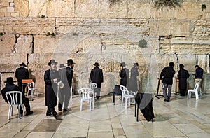 Jews worship at the stones of the Western Wall