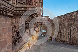 Jharokha, stone window projecting from the wall face of a building, in an upper story, overlooking Mehrangarh fort, Jodhpur,