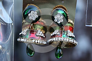 jhumka earrings with green red mirror work with fake stones and hangging green beads.