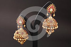 jhumki. golden earrings for women with white and green red diamonds traditional wedding wear for women,