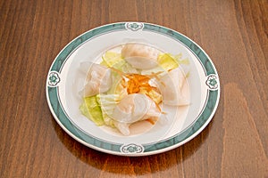 A jiaozi and also known as mandu, is a type of dumpling or ravioli typical