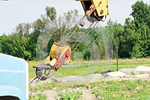 Jib crane on the sky background. Place for your text.