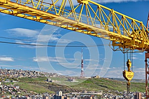 Jib crane tower against blue sky