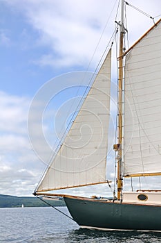 Jib, Foresail and Wooden Mast of Schooner Sailboat photo