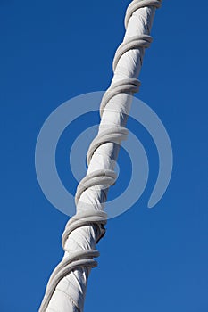 Jib sail, rolled up and stored; detail close up