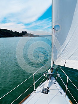 Jib sail on a sailboat on turquoise water