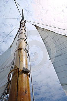 Jib and Wooden Mast of Schooner Sailboat photo