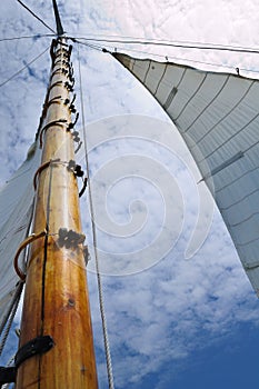 Jib and Wooden Mast of Schooner Sailboat photo