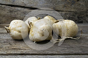 Jicama on grunge wooden background