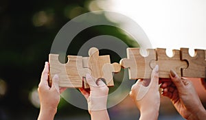 jigsaw in hand puzzle pieces gather together teamwork The concept of planning work as a team