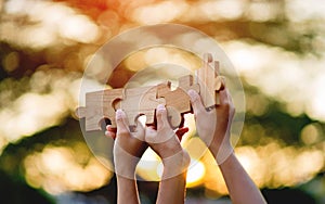 jigsaw in hand puzzle pieces gather together teamwork The concept of planning work as a team