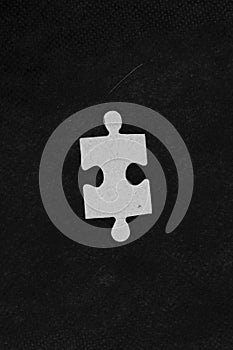 Missing jigsaw puzzle pieces in unfinished work.