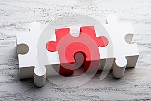 Jigsaw Puzzle Block On White Textured Background