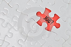 Jigsaw puzzle over red background written with JOB