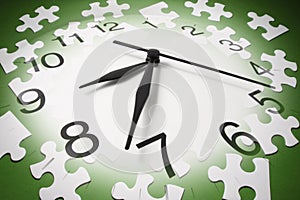 Jigsaw Puzzle Pieces and Clock