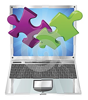 Jigsaw puzzle pieces flying out of laptop computer