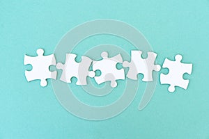 Jigsaw puzzle pieces in row