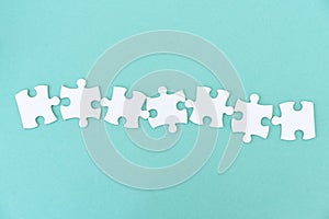 Jigsaw puzzle pieces in row