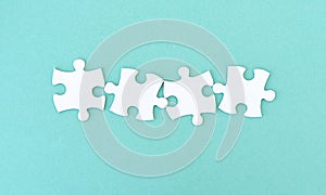 Jigsaw puzzle pieces in row photo