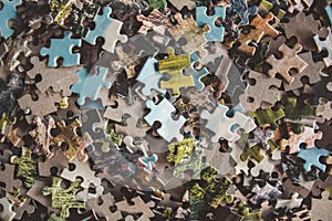 Jigsaw puzzle. Pile of jigsaw puzzle peices. Conceptual photo with focus on undone puzzle