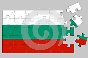 A jigsaw puzzle with a print of the flag of Bulgaria, some pieces of the puzzle are scattered or disconnected. Isolated background