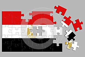 A jigsaw puzzle with a print of the flag of Egypt, some pieces of the puzzle are scattered or disconnected. Isolated background.