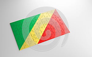 A jigsaw puzzle with a print of the flag of Republic of Congo, pieces of the puzzle isolated on white background.