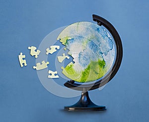 Jigsaw puzzle in shape of globe