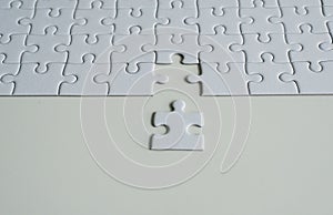 Jigsaw puzzle white color,Puzzle pieces grid,Close up,Top view copy space for text